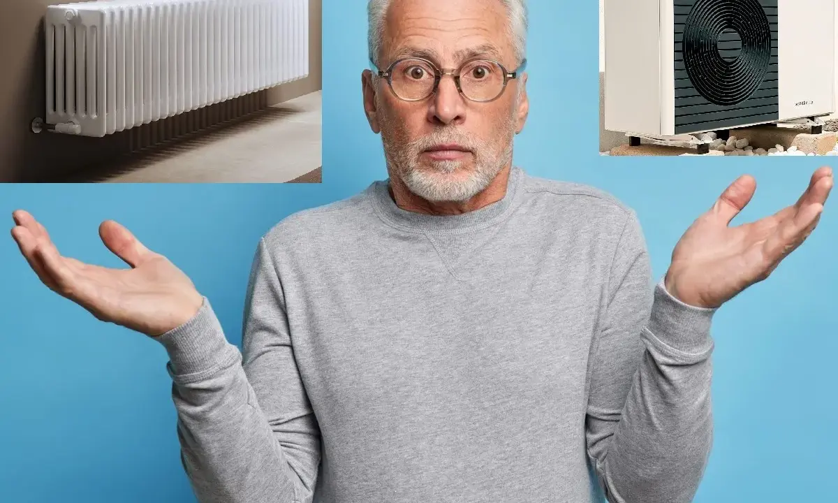 Uomo perplesso con radiatore e pompa di calore. Quali sono i migliori radiatori per pompa di calore?